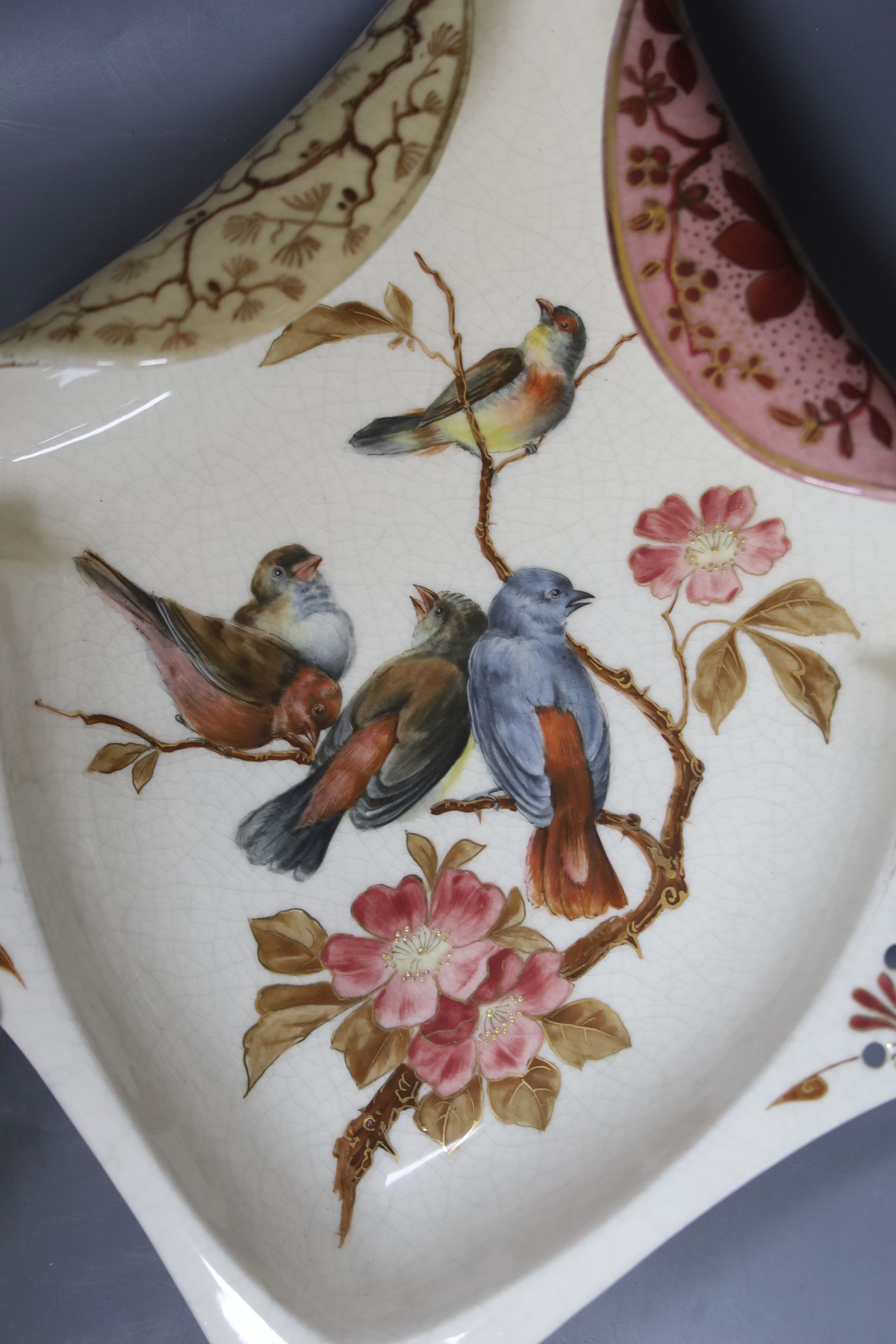 A pair of Victorian earthenware dessert dishes, decorated with birds and flowers, length 35cm